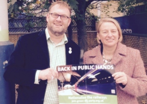 Natalie Bennett poses with a 'renationalise the railways' poster with Green PPC Tony Mabbott. Photo credit: Leighton Buzzard Observer