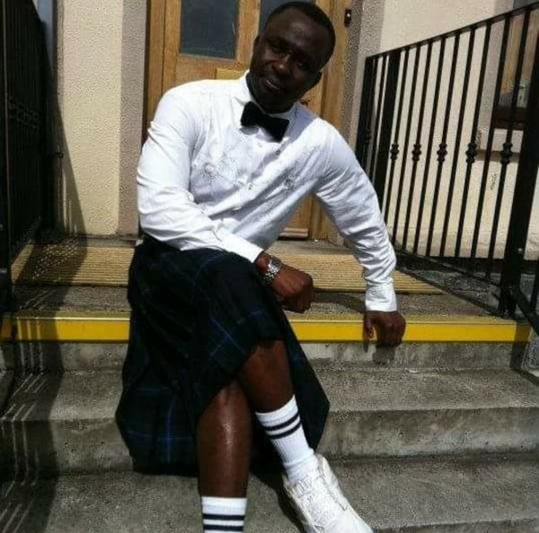 Photo of Lord sat on steps wearing a kilt