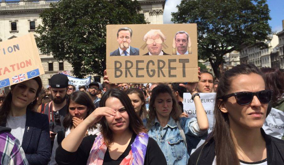 An activist holding a "Bregret" sign