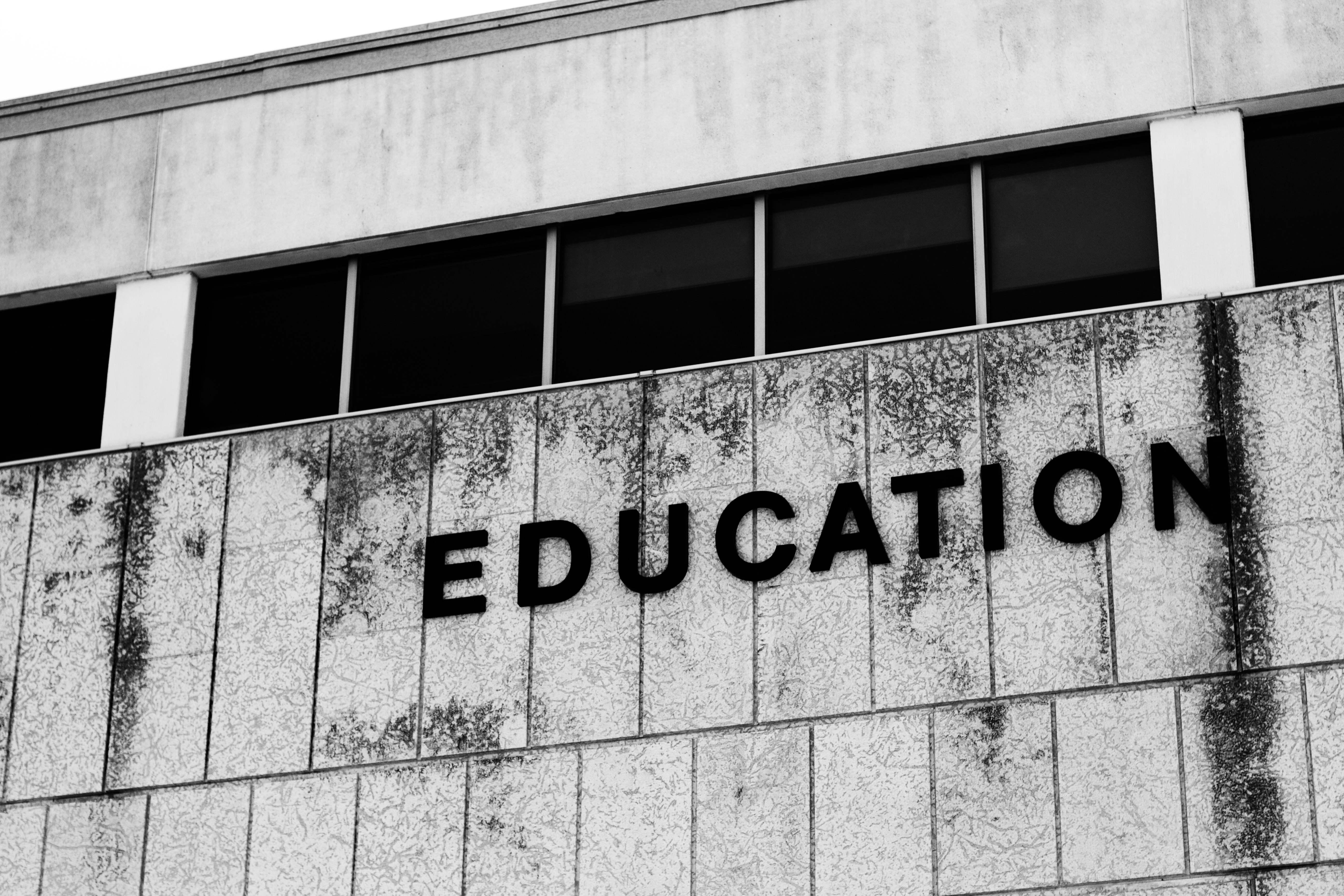 The word ‘EDUCATION’ written on the side of a dirty building. Photo by Alan Levine via Flickr (https://www.flickr.com/photos/cogdog/14207665792/)
