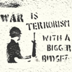 "War is Terrorism with a bigger budget" graffitied on a wall