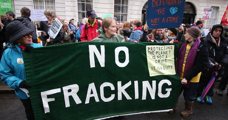 Banner at a protest reading: no fracking
