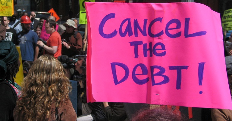 Protest with a banner reading "cancel the debt"