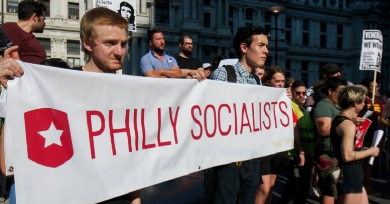 A group of people with a banner reading "Philly Socialists"