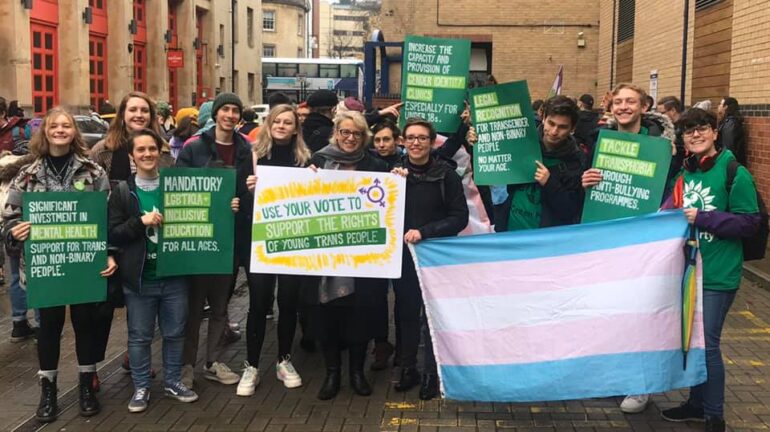 A photo of campaigners at a trans rights march
