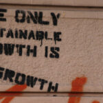Graffiti which reads the only sustainable growth is degrowth