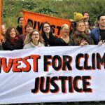 A group of people holding a banner reading "Divest for Climate Justice"