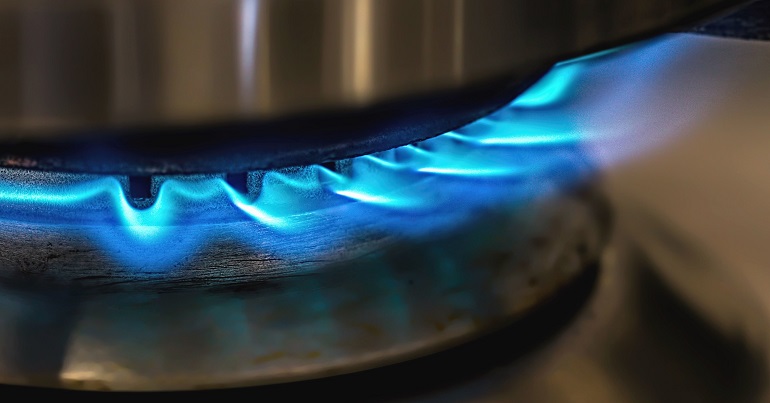A photo of a lit gas hob