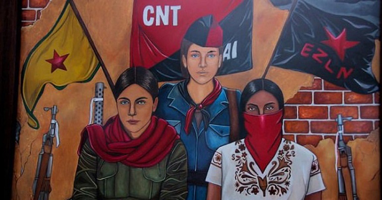 A mural with three women in front of flags of the YPG, the CNT and the Zapatistas
