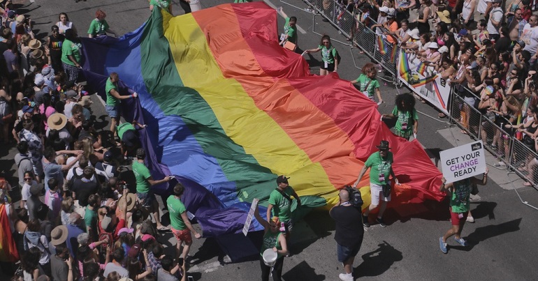 A LGBT Pride flag at a Pride march