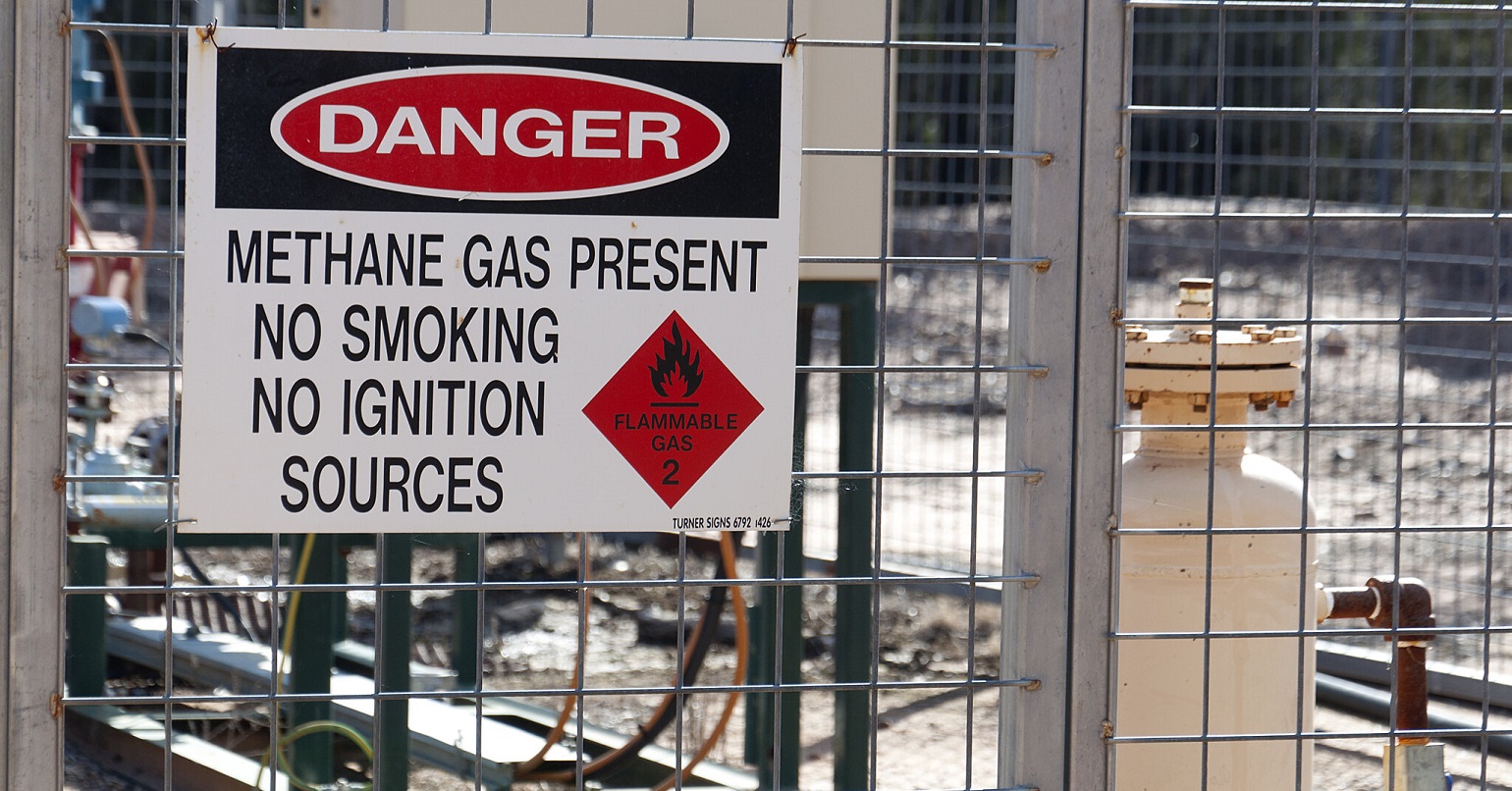 A sign reading "Danger - methane gas present'