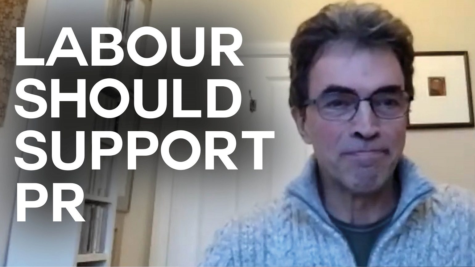 A still of an interview with Unlock Democracy director Tom Brake with text reading "Labour should support PR"