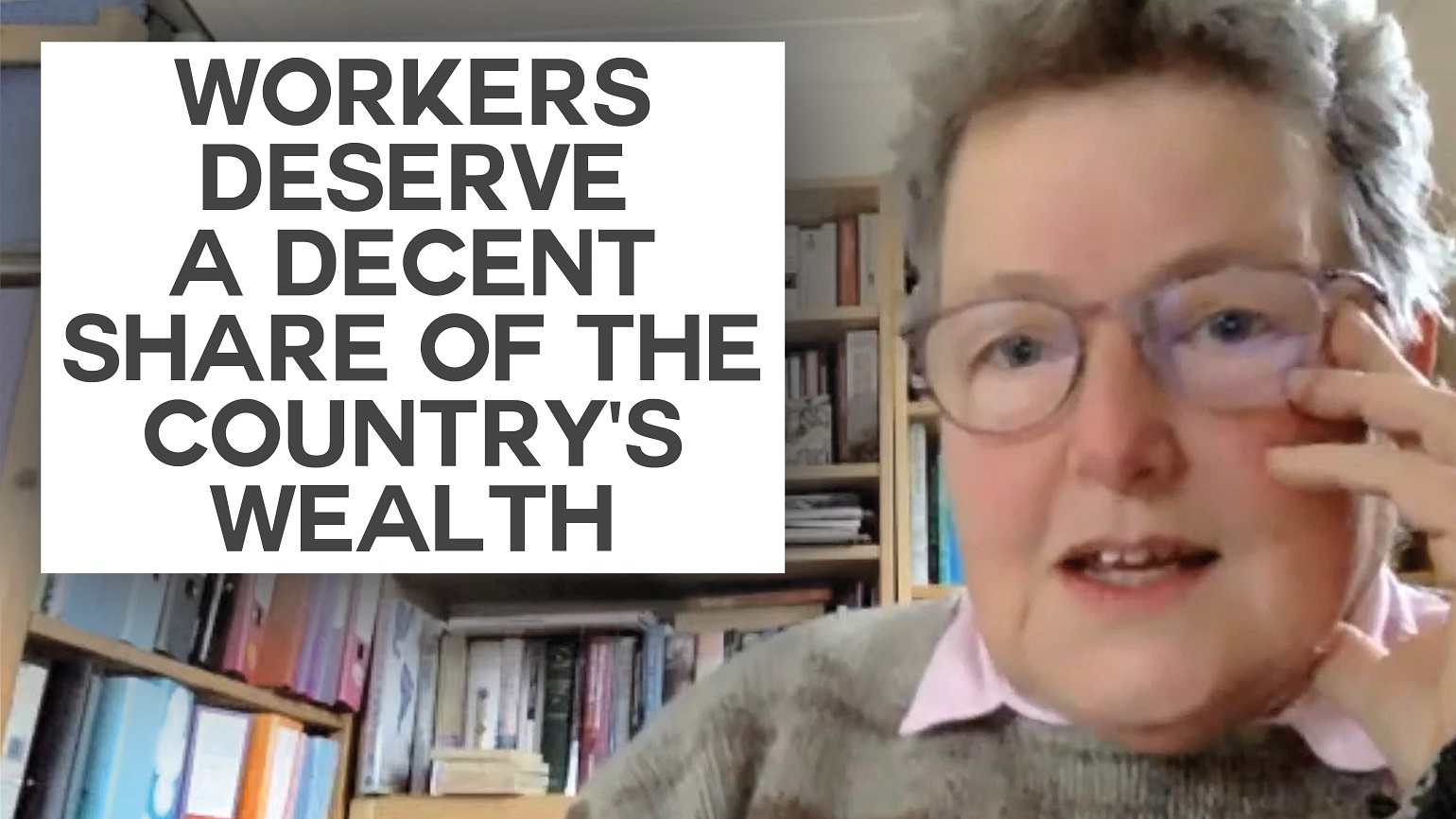 A still of an interview with Catherine Rowett with text reading "Workers deserve a decent share of the country's wealth"