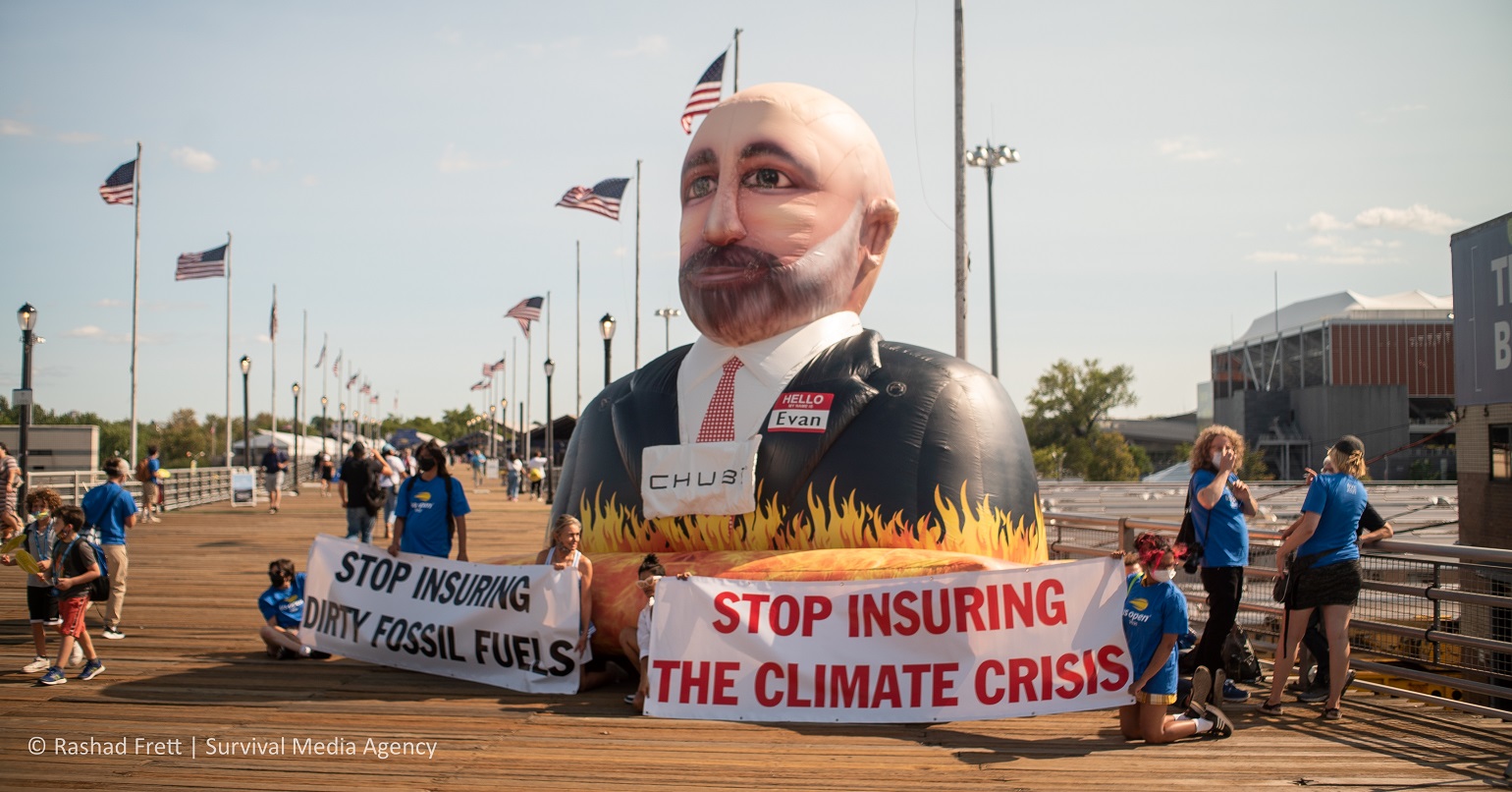 A photo of a protest calling for Chubb to stop insuring fossil fuels