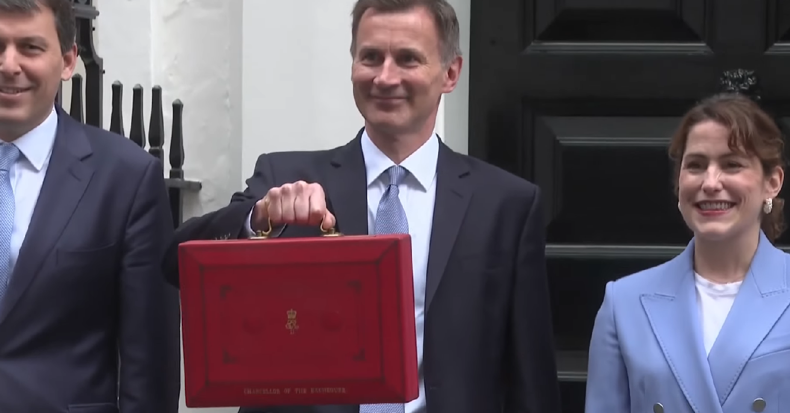 Jeremy Hunt holding the budget briefcase in Downing Street