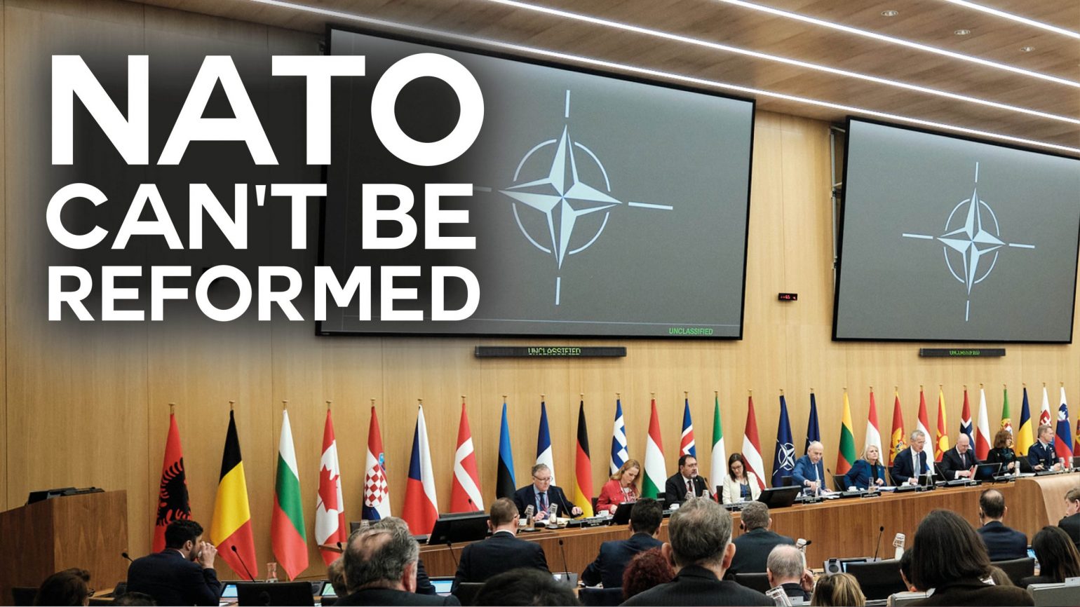 A photo of a NATO meeting with text overlaid reading "NATO can't be reformed"