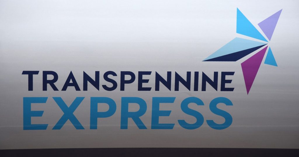 A transpennine express logo on the side of a train