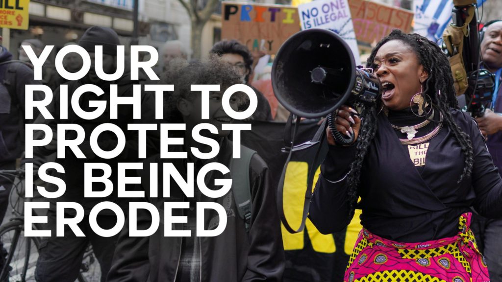 A photo of a protester with a megaphone with text overlaid reading "Your right to protest is being eroded"