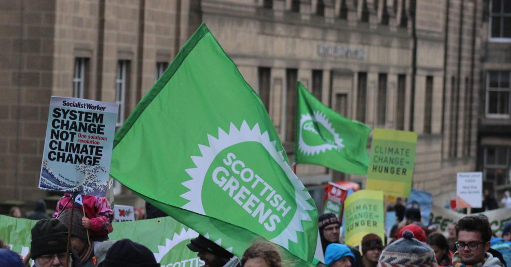 Scottish Green Party flags on a demonstration