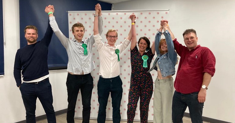 A photo of Bristol Green Party campaigners celebrating a by-election victory