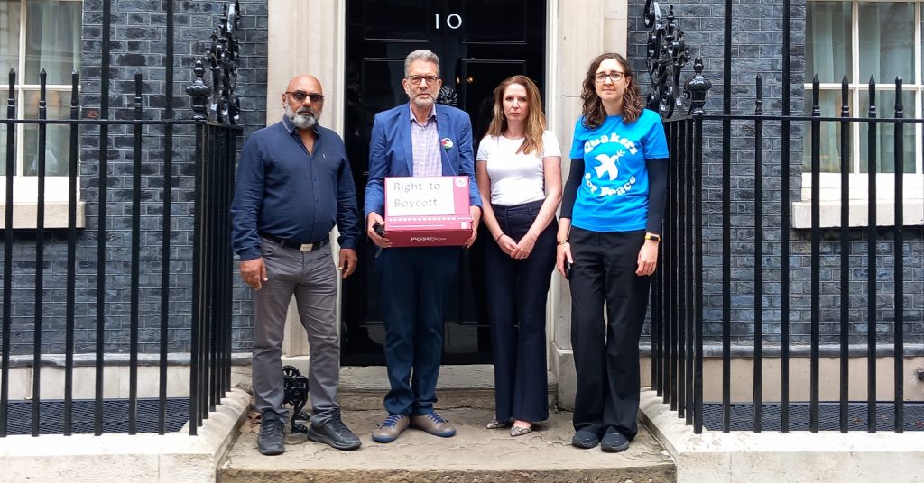 Campaigners outside Number 10 Downing Street handing in a petition against the anti-boycott bill