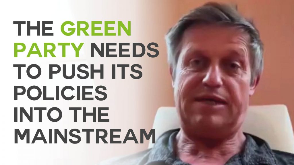 A still of an interview with Chas Warlow with text overlaid reading 'The Green Party needs to push its policies into the mainstream'